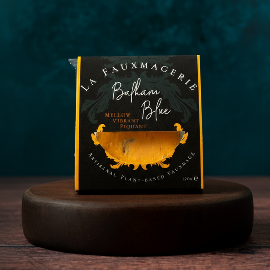 Packaged shropshire blue style cheese on plynth